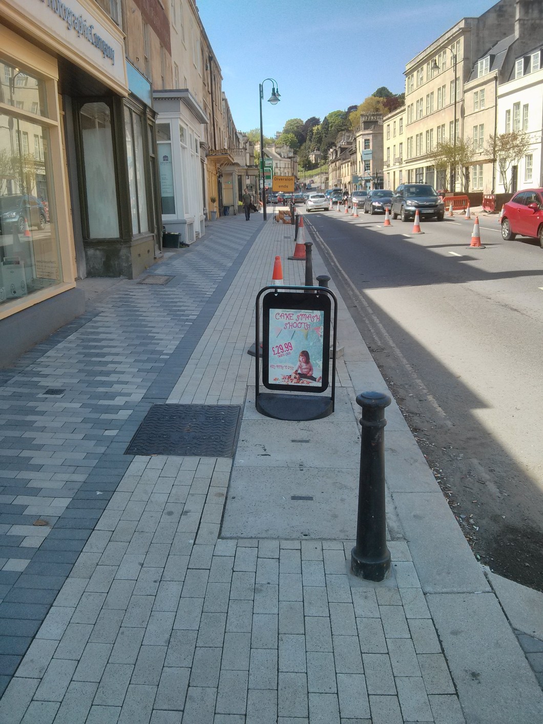Businesses putting signs in the cycle track. Not unnecessary work sign in the cycle track.