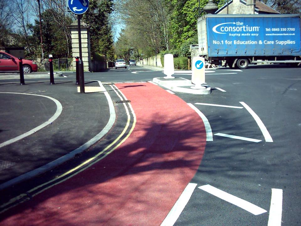 The Combe Down Roundabout. Paint in red shows the cycle lane. This should be used (or something similar) to mark out explicitly the cycle contraflows. It's crazy not to.
