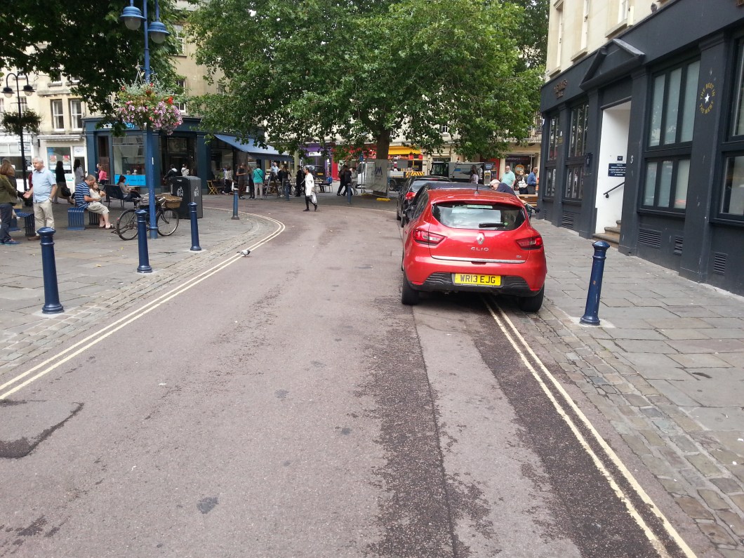 Cars parked in the unmarked cycle contraflow on Avon Street.