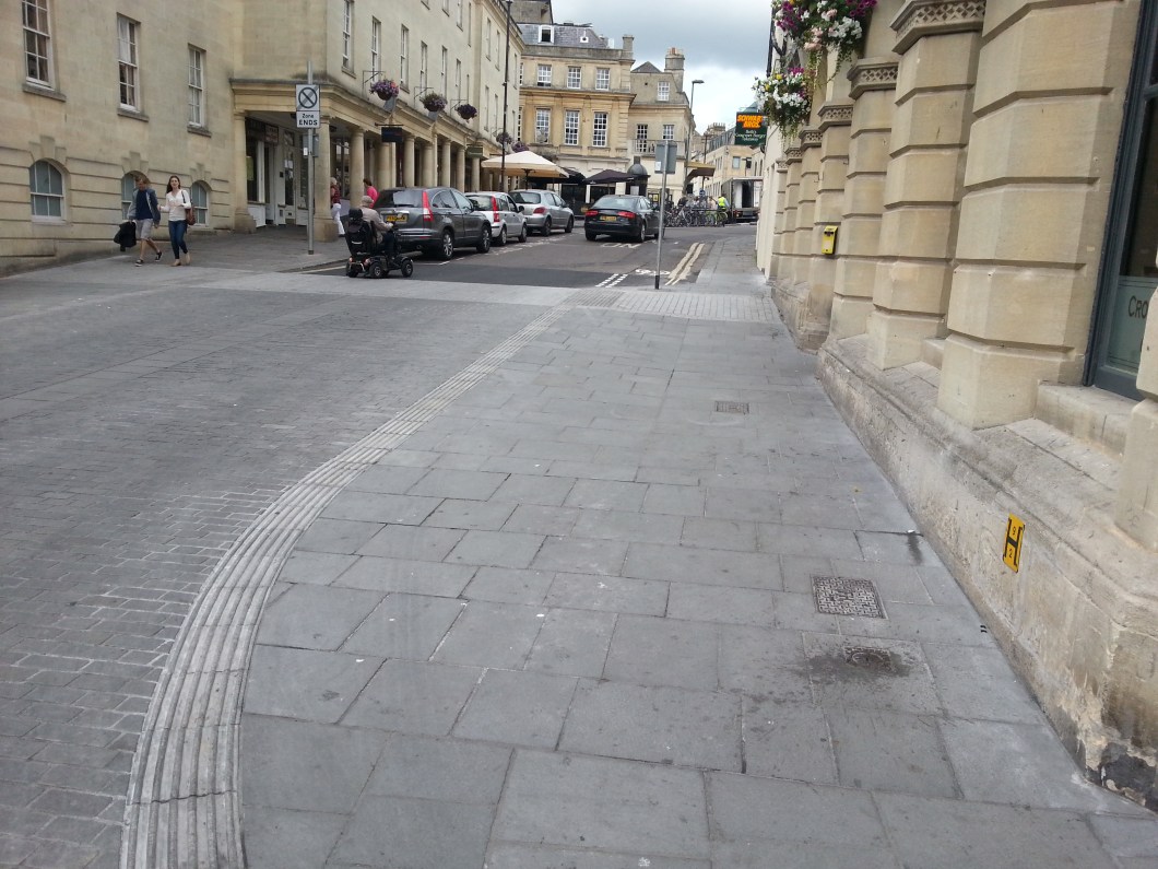 Saw Close Contraflow. Note that the widened paving is unnecessary and a better protected cycle contraflow would have been better to protect cyclists from cars coming along Westgate Buildings. 